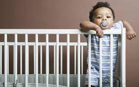 toddlers sleep in a crib