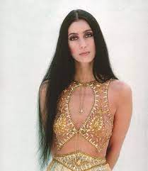 Contrasty portrait with the jet black hair and seamless white skin. Groovy History On Twitter Beautiful Photo Of Cher From 1975 Beautiful Photo Cher 1975 1970s 1960s 60s 70s Groovy Retro Rocknroll Music Love Vintage Funky Studio54 Hippie Style Groove Woodstock 70smusic