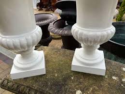 Set Of Four Cast Iron Urns In White 43 Cm