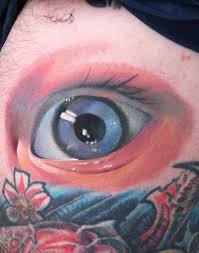 colored flowers and eye tattoo