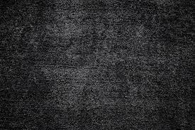 closeup of black carpet texture dark