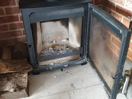 how to clean wood burning stove glass