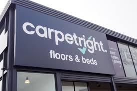 carpet retailer narrows losses but