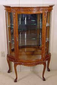 Serpentine Glass Oak Curio Cabinet