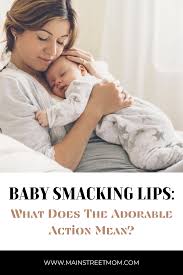 baby smacking lips what does the