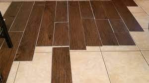 Once you've removed lose or broken pieces, patch the empty sections with a liquid cement or mortar, letting it settle level with the tile floor. Vinyl Plank Flooring Over Tile Should I Do This Youtube