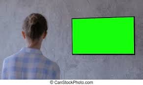 Green screen or also known as chroma key is used when you swap the background of a video with another background. Woman Watching Green Screen 4k Flat Screen Tv On Coach At Home Canstock