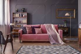 pink velvet lounge with cushions and