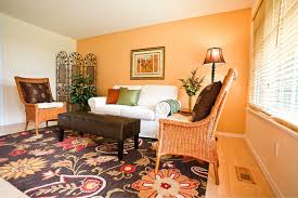 The walls in this room are deep pumpkin orange and a great choice against the lighter neutrals. Living Room Light Orange Wall Paint Novocom Top