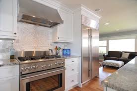 white kitchen with stainless steel