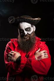 bearded man in pirate outfit wearing