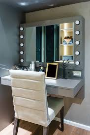 dressing table near mirror in makeup room