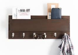 For the cute braces on the rack, we cut 4 pieces of 2×4 both ends at 45 degree angles @ 13″ long point to long and we attached it to the top of the coat rack with wood glue and 2 1/2 inch wood screws. Diy Wood Coat Rack Mail Holder Diy Huntress