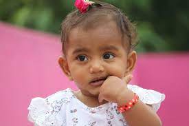 cute indian baby looking at camera