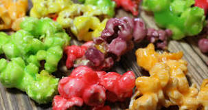How do you make colored popcorn with Skittles?
