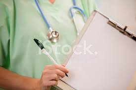 Female Doctor Or Nurse Holds Blank Medical Chart Stock