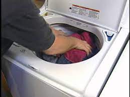 lint on clothing from top load washer