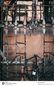 Old Iron Gate With Wrought Iron Work In