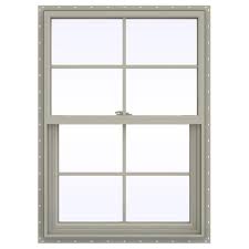 jeld wen 29 5 in x 47 5 in v 2500 series desert sand vinyl single hung window with colonial grids grilles