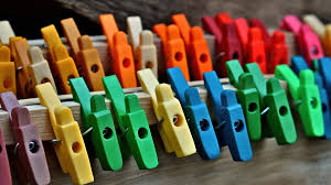various colored pegs lined up on a