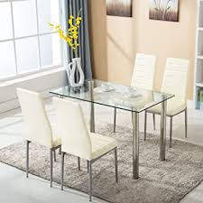 The sculptural base of this glass dining room table is a standout in and of itself. Amazon Com Mecor 5 Piece Dining Table Set Tempered Glass Top Dinette Sets With 4 Pu Leather Chairs For Dining Room Kitchen Furniture Breakfast Light Yellow Table Chair Sets