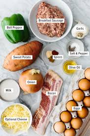 1 tablespoon olive oil · 1 pound (500 g) diced bacon, chopped (or uncooked sausages, casings removed) · 10 large eggs · 1 cup milk (half and half or heavy cream) . Loaded Breakfast Casserole With Sausage Downshiftology