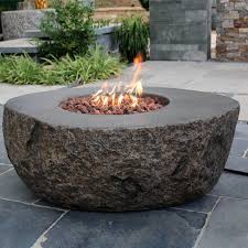 Fire pits add elegance to an otherwise boring backyard by allowing its inhabitants to seek warmth and do other activities that could make the family even closer. Boulder Fire Pit