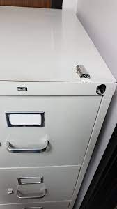 Because the file cabinet bar lock is firmly attached to the side of the filing cabinet. The Lock Cylinder Popped Out Of My Filing Cabinet Leaving The Lock Inside Engaged It S Now Permanently Locked Wellthatsucks