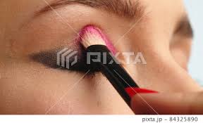 make up artist applies makeup to the