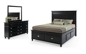 It includes two nightstands and one bed, all made from a blend of solid and engineered wood in a neutral hue. Spencer Storage King Black Bedroom Set Bob S Discount Furniture