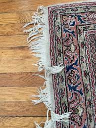how do you vacuum a rug with fringe