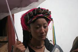 Young Khampa woman with traditional jewellery and umbrella | Khampa Tibetans  | Kham | Travel Story and Pictures from China