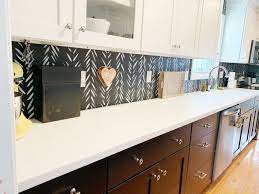 Susan's hand painted tile backsplash uses the tulip and pomegranate repeating pattern, with running cobalt blue borders on the top and bopttom. Handpainted Kitchen Backsplash