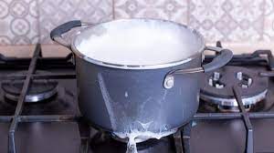 to clean burnt milk from your stove top