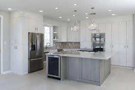Discount cabinets & appliances has been serving the people of colorado since 1977, helping clients realize their dreams of creating a stylish kitchen at a great value. Contemporary White Laminate Kitchen With Gray Island Crystal Cabinets