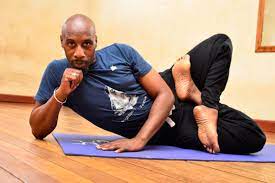 the man teaching afrikan yoga monitor
