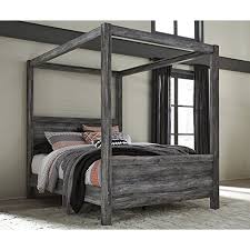 You're purchasing a queen canopy bed but are unsure which of three types of bed frames will be best for the room in which the bed will reside. Signature Design Baystorm Gray Wood Queen Canopy Bed By Ashley Walmart Com Walmart Com