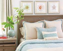 arrange decorative toss pillows on bed
