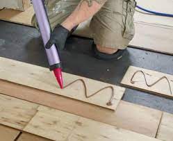 can you glue down solid wood flooring