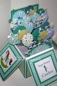 I believe it's called a go round card. 1st Birthday Card In A Box Sizzix Balloons And Stars Cheery Lynn Wishes Tonic Scalloped Squares Dig Pop Up Box Cards Box Cards Tutorial Exploding Box Card