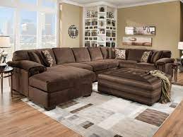This setup gives you a lot of room to add an accent chair and poufs for extra seating space—perfect for big hangouts and gatherings. 20 Of The Most Comfortable Oversized Ottoman Ideas Housely Brown Living Room Decor Brown Sectional Living Room Furniture
