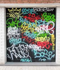 A garage grafitti session, artwork by chad, nacho, juju and scott. Garage Door Graffiti Garagedoortrends Garagedoorstyles Garagedoor Overheaddoor Canada Saskatchewan Garage Doors Graffiti Sectional Garage Doors