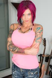 A busty tattooed woman from Randy