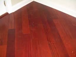 Old worn white oak floors get a makover with provincial stain to achieve a warm medium toned brown. How To Get Cherry Colored Or Reddish Hardwood Floors