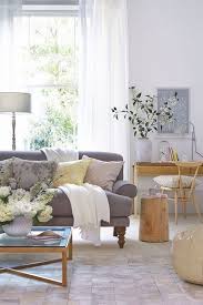 Grey Sofa And Wooden Accessories