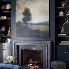 Dark Blue Wall With White Fireplace