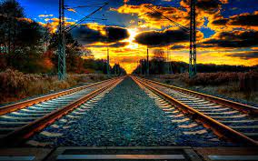 railway track to horizon track sunset