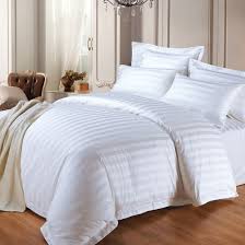 cotton bedding set and white bed sheet