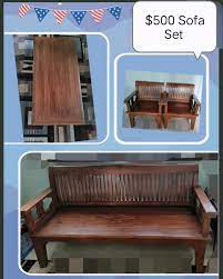 teak wooden sofa set and coffee table