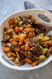 You want to give the food enough time to cook and if you turn the heat up. Air Fryer Sweet Potatoes And Brussels Sprouts Garnished Plate